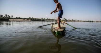 A young Egyptian fisherman pulls his net in the River Nile, south of the Egyptian capital, with Egypt suffering for years from an acute water crisis. By Khaled DESOUKI (AFP)