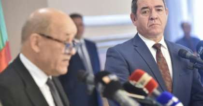Algerian Foreign Minister Sabri Boukadoum (R) listens to his French counterpart Jean-Yves Le Drian during a joint press conference in the capital Algiers. By RYAD KRAMDI (AFP)