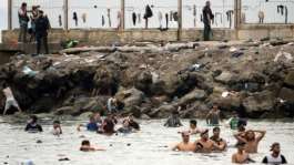 An unprecedented 72,000 people poured into Ceuta from Morocco from July 30, mostly by swimming.  By JORGE GUERRERO (AFP)