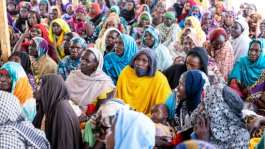Chadian returnees met with an International Organization for Migration (IOM) delegation in Tongori.  By Joris Bolomey (AFP)