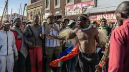 Imposing Zulu campaigner Phakela Ndabandaba has fronted many marches against undocumented migrants.  By EMMANUEL CROSET (AFP)