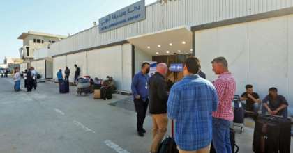 Passengers wait to depart Libya's Mitiga International Airport in Tripoli as flights resume. By Mahmud TURKIA (AFP)
