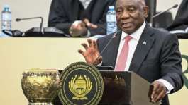 President Cyril Ramaphosa is facing questions over half-a-million dollars that was stashed in a sofa at his ranch.  By RODGER BOSCH (AFP)