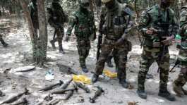 Senegalese troops walk through a captured rebel base.  By JOHN WESSELS (AFP/File)