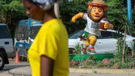 Statues of the Youth Olympics mascot Ayo the lion playing various sports have been installed throughout Dakar.  By SEYLLOU (AFP)