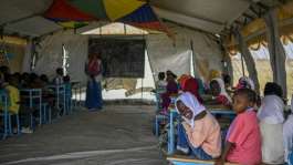 Sudanese children attend class in a tent at a displacement camp.  By Khaled DESOUKI (AFP)